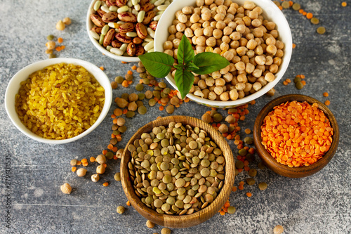 Healthy food, dieting, nutrition concept, vegan protein source. Raw of legumes (chickpeas, red lentils, canadian lentils, beans, bulgur, chickpea).