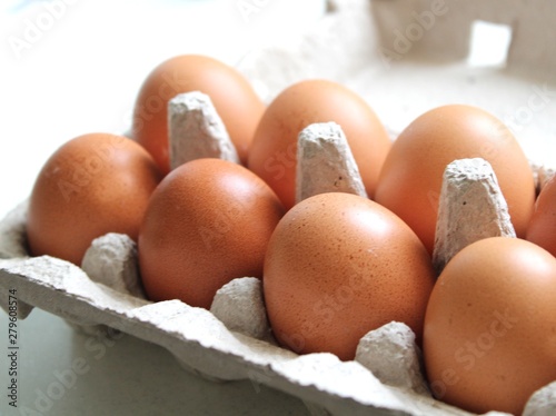 Close up view of brown organic eggs photo