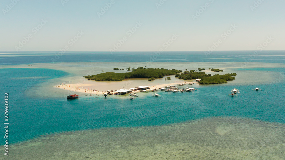 Beautiful beach on tropical island surrounded by coral reef, sandy bar with tourists. honda bay top view. Luli island. Summer and travel vacation concept, Philippines, Palawan Beautiful beach on tropical island surrounded by coral reef, sandy bar with tourists. honda bay top view. Luli island. Summer and travel vacation concept, Philippines, Palawan