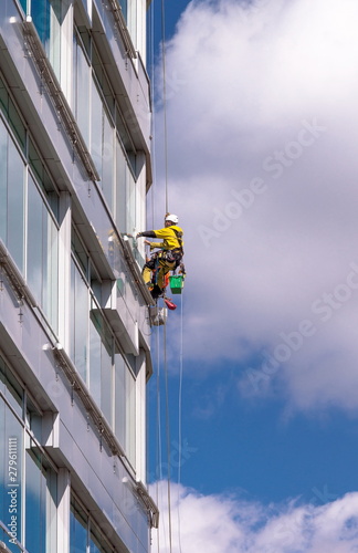 industrial cleaners on the skyscraper surface