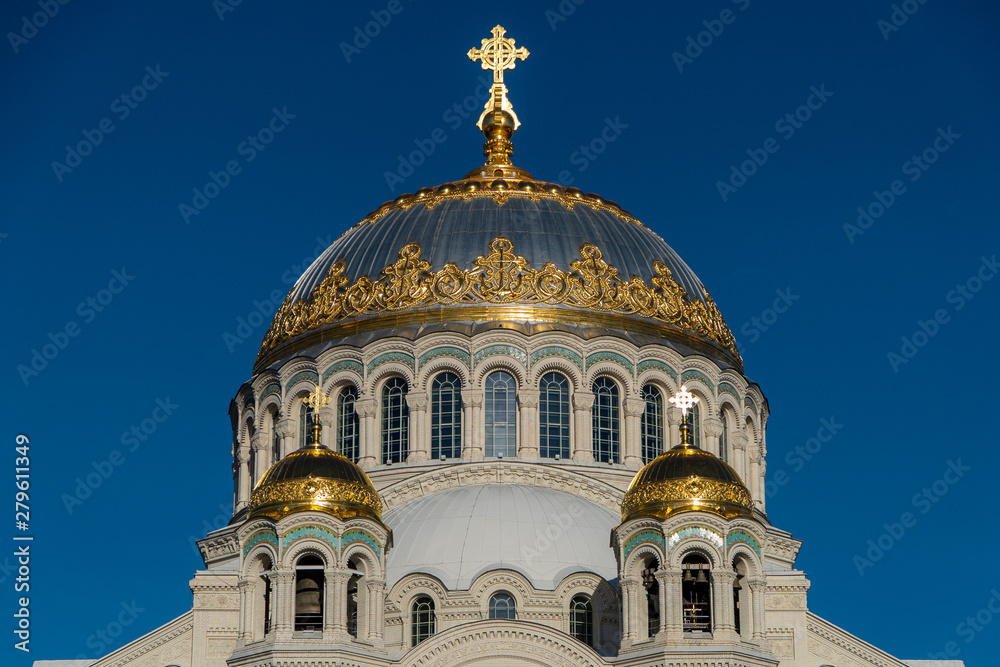 The dome of the Cathedral of St. Nicholas, illuminated by sunlight.