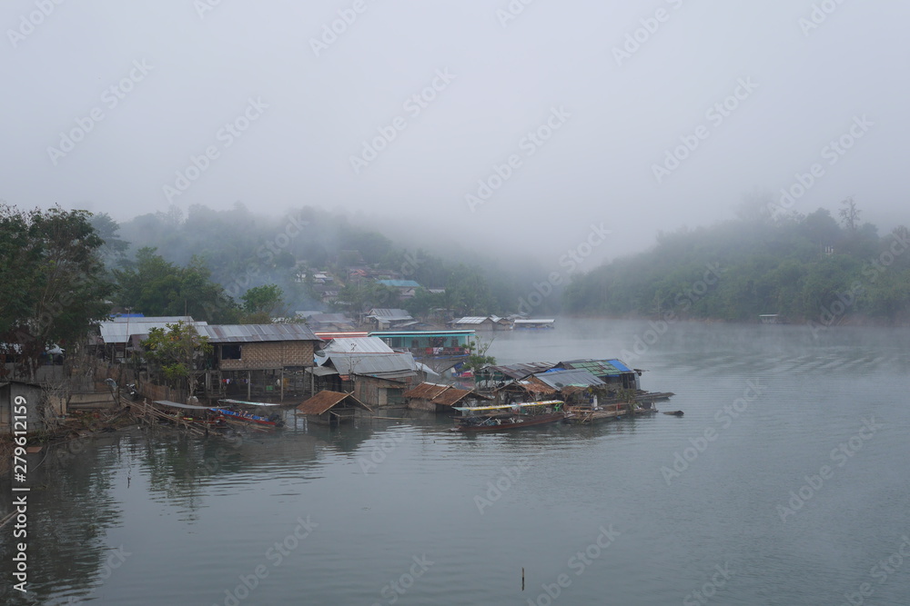 Early morning mist over lake and village