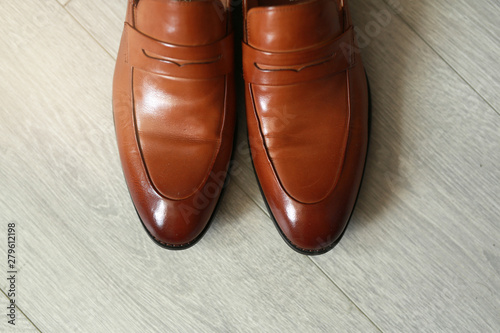 stylish classic brown shoes on the floor
