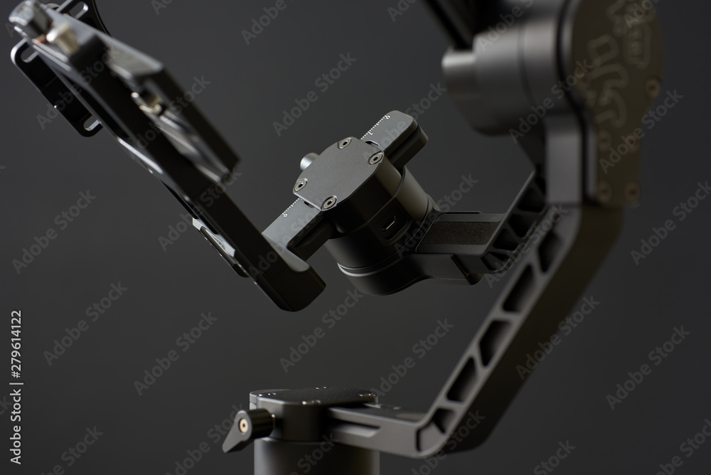 Fototapeta premium Close-up of gimbal stabilizer, with low-key lighting and a black background