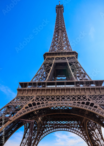 Eiffel Tower against blue sky with clouds in Paris  France. April 2019
