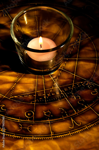 candle with horoscope and zodiac signs like astrology concept 