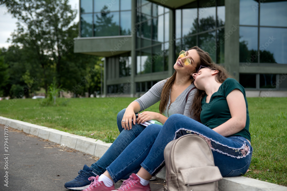 Female college students on university campus Female college students on university campus