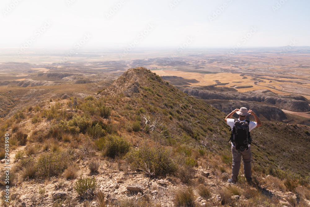 backpacker traveler with hat and white shirt