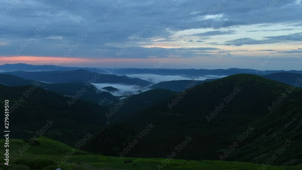Amazing flowing fog in mountains in sunset time. Timelapse of beautiful nature of Carpathians. UHD 4K video Amazing flowing fog in mountains in sunset time. Timelapse of beautiful nature of Carpathians. UHD 4K video