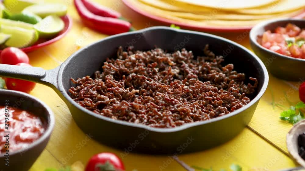 Various fresh and tasty ingredients for chilli con carne. With meat on iron pan Various fresh and tasty ingredients for chilli con carne. With meat on iron pan