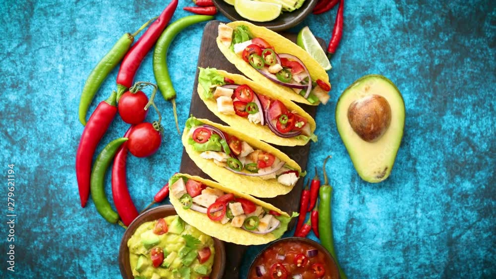 Mexican taco with chicken meat, jalapeno, fresh vegetables served with guacamole
