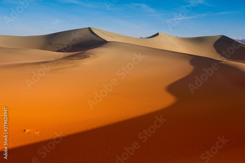 Desert Sand Dunes ripples with sunrise blue sky, Death Valley California © Jantira