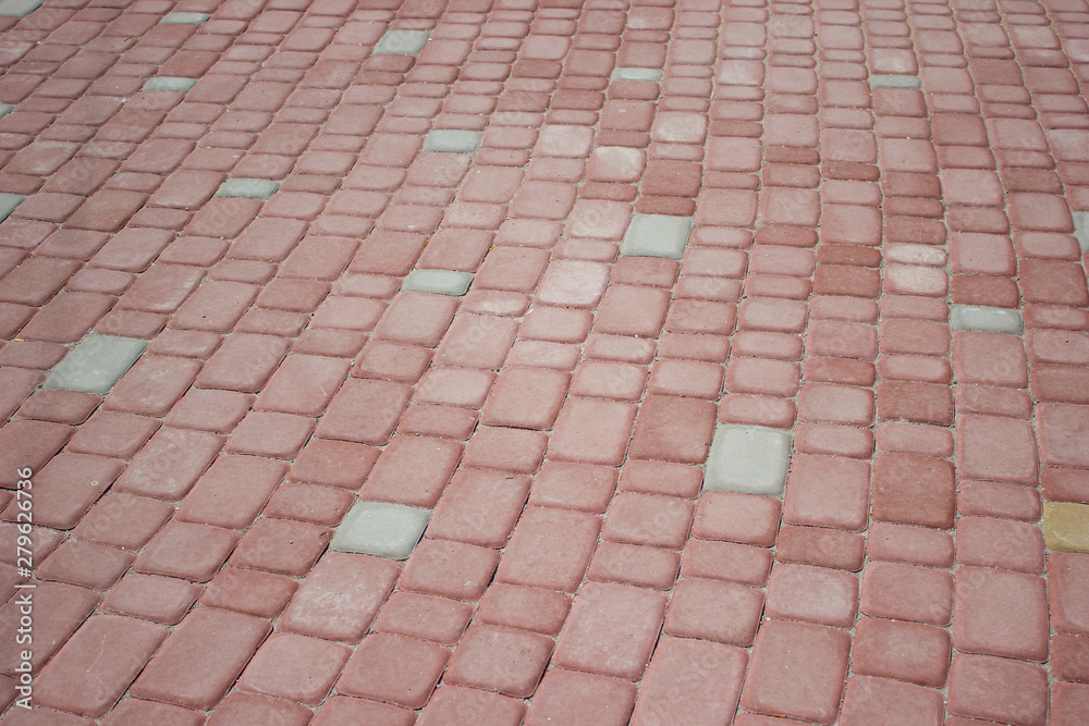 Texture of red floor paving tiles in city - background