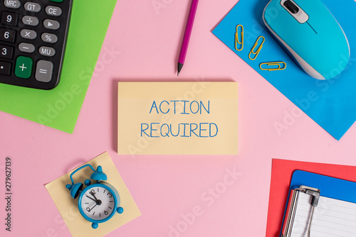 Conceptual hand writing showing Action Required. Concept meaning Regard an action from someone by virtue of their position Mouse calculator sheets marker clipboard clock color background photo