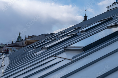 Roof windows and skylights and blue sky