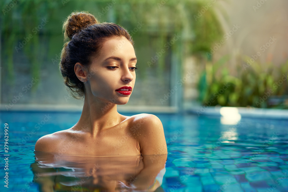 Retreat and vacation.. Beautiful young woman relaxing in spa swimming pool. Retreat and vacation.. Beautiful young woman relaxing in spa swimming pool.