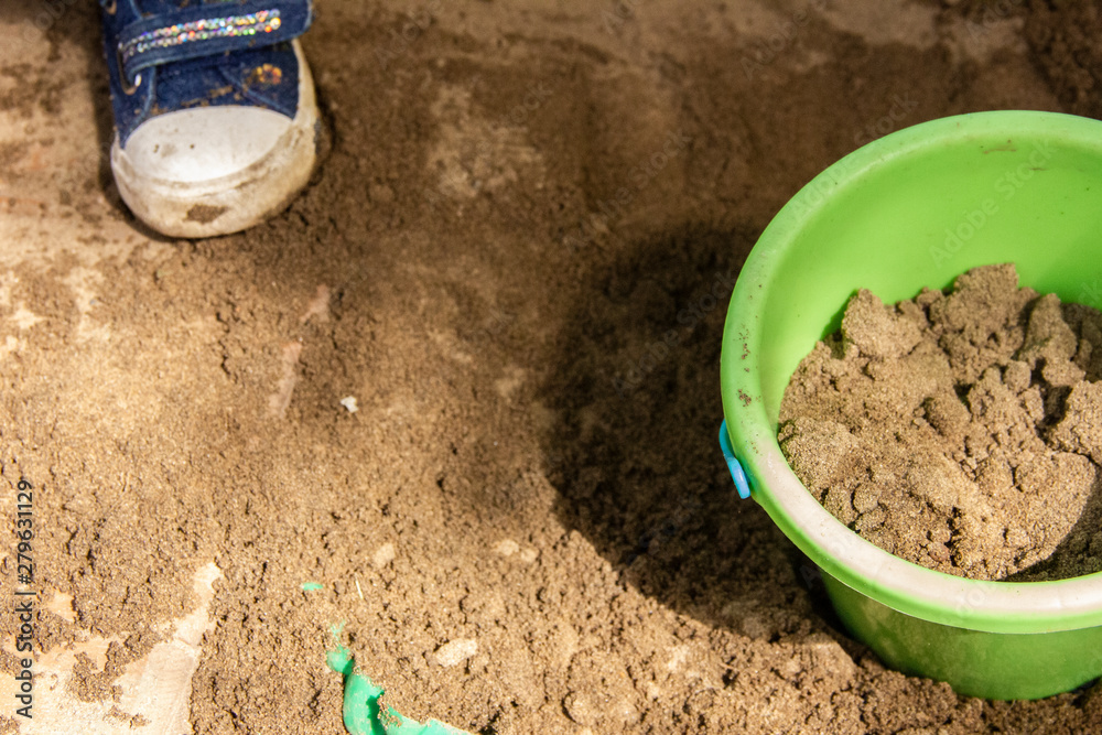 Children play in a sandbox with molds and knives. Sculpting sand figures. Children play in a sandbox with molds and knives. Sculpting sand figures.