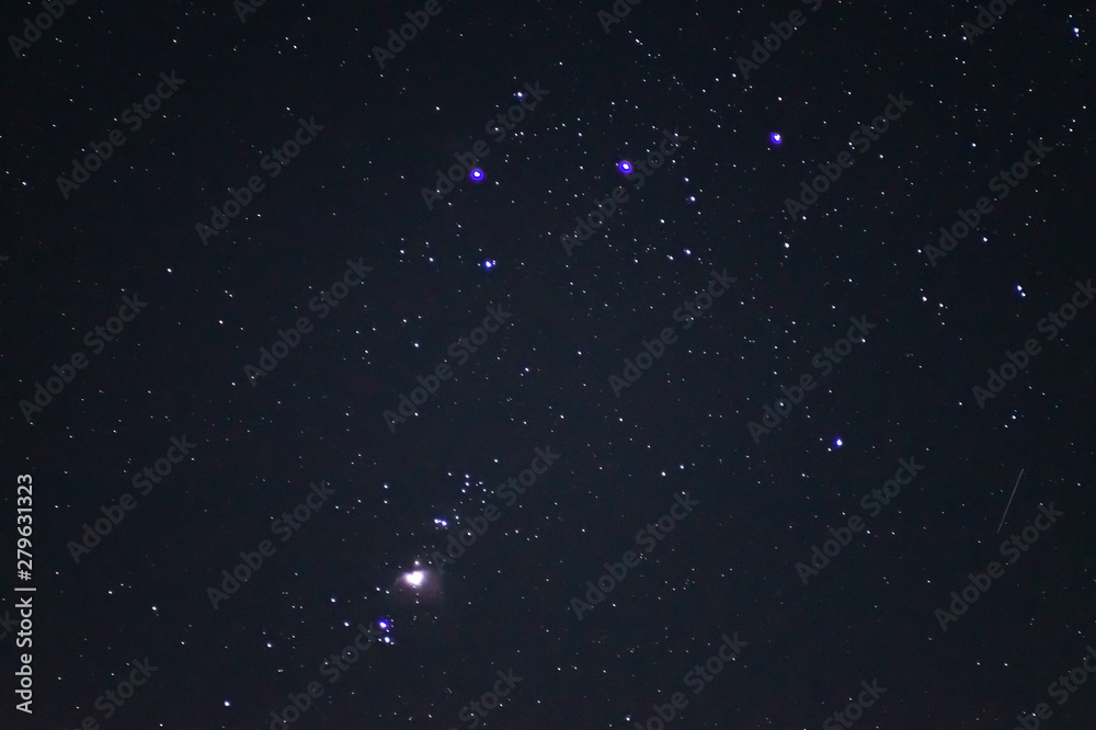 Obraz premium Underexposed night sky low light photo. A lot of stars and constellations on dark sky. Stock photo of deep sky.