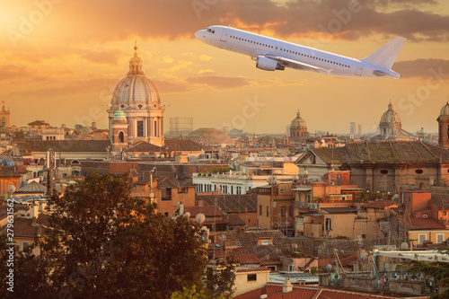 Canvas Print plane over the Vatican at sunny sunset