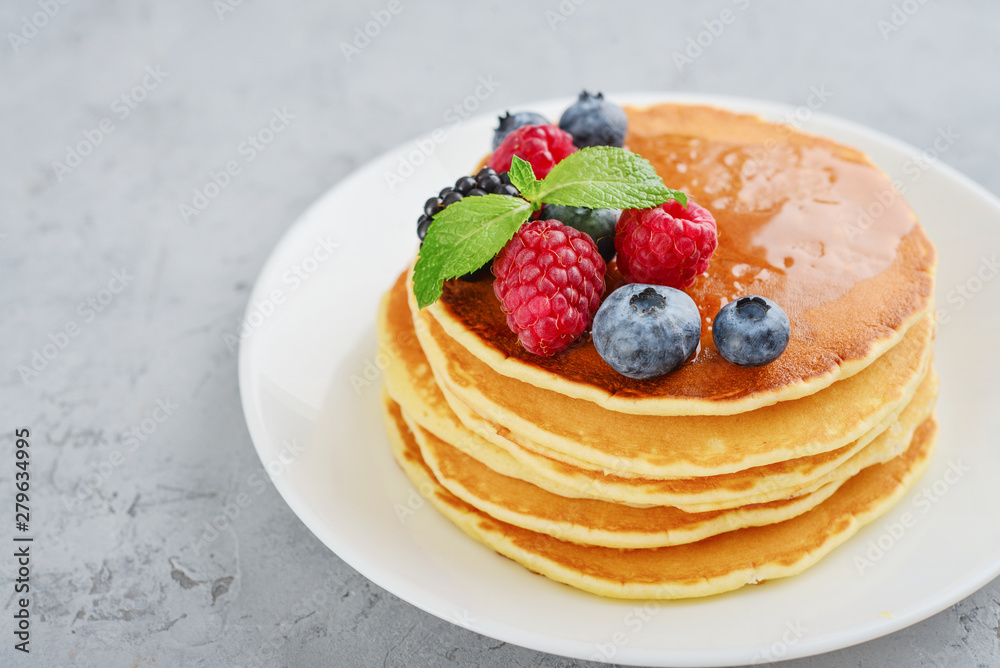 Pancakes with fresh berries and maple syrup Pancakes with fresh berries and maple syrup