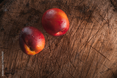 ripe sweet nectarine on a wooden background