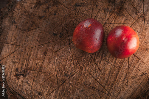 ripe sweet nectarine on a wooden background