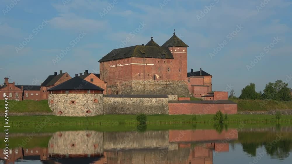 Fortress Hameenlinna at lake Vanajavesi, July afternoon. Finland Fortress Hameenlinna at lake Vanajavesi, July afternoon. Finland