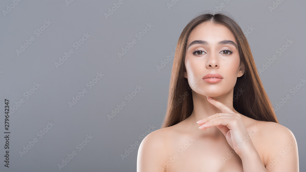 Portrait of young gorgeous beauty model on grey background Portrait of young gorgeous beauty model on grey background