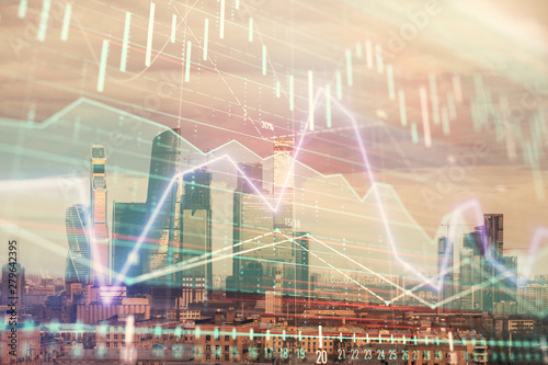 Double exposure of financial graph on downtown veiw background. Concept of stock market research and analysis