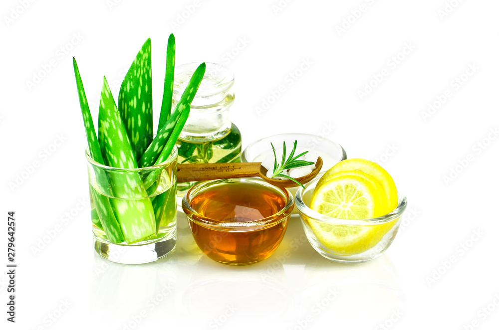 Aloe Vera, Lemon, greek yogurt, honey, rosemary, sea salt and essential oil homeopathy remedy recipe on white background. Aloe Vera, Lemon, greek yogurt, honey, rosemary, sea salt and essential oil homeopathy remedy recipe on white background.