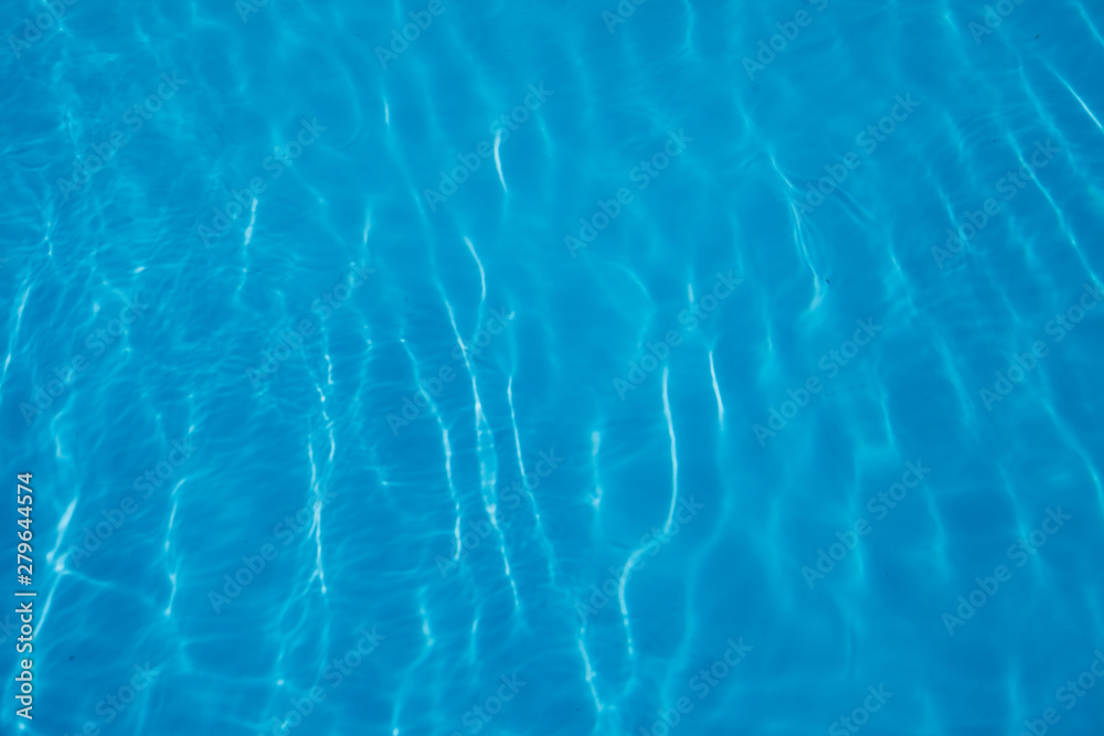 blue water background. turquoise marine texture.Sunny highlights in the water. blue water background. turquoise marine texture.Sunny highlights in the water.
