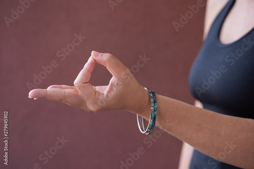 Hands in Gyan Mudra symbolic  and spiritual gesture in yoga, often used while meditating and for promote physical and mental health photo