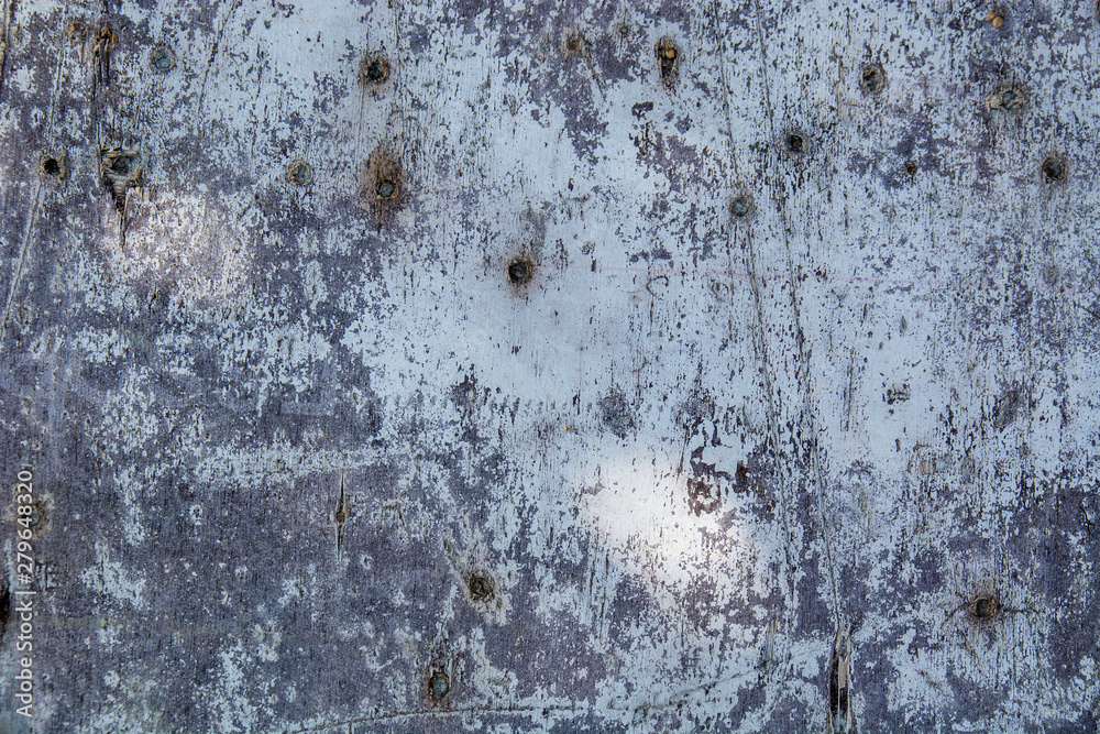 Metal fence covered in paper and glue with interesting texture Metal fence covered in paper and glue with interesting texture