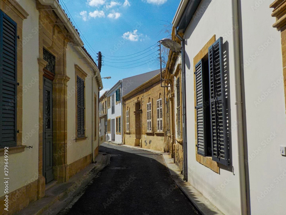 a small street with houses in greece