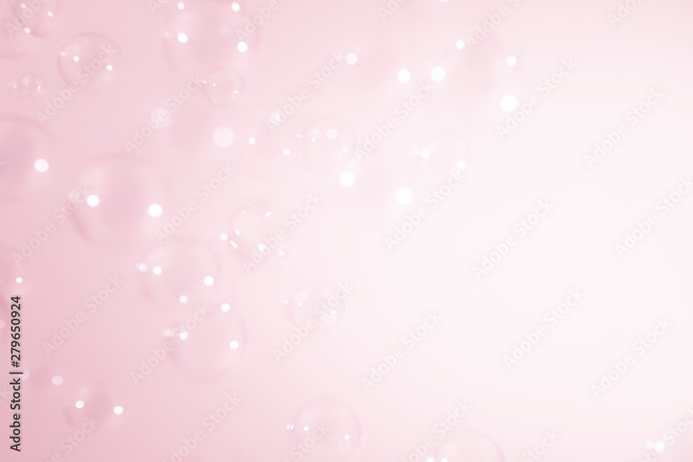bright soap bubbles on pink background.