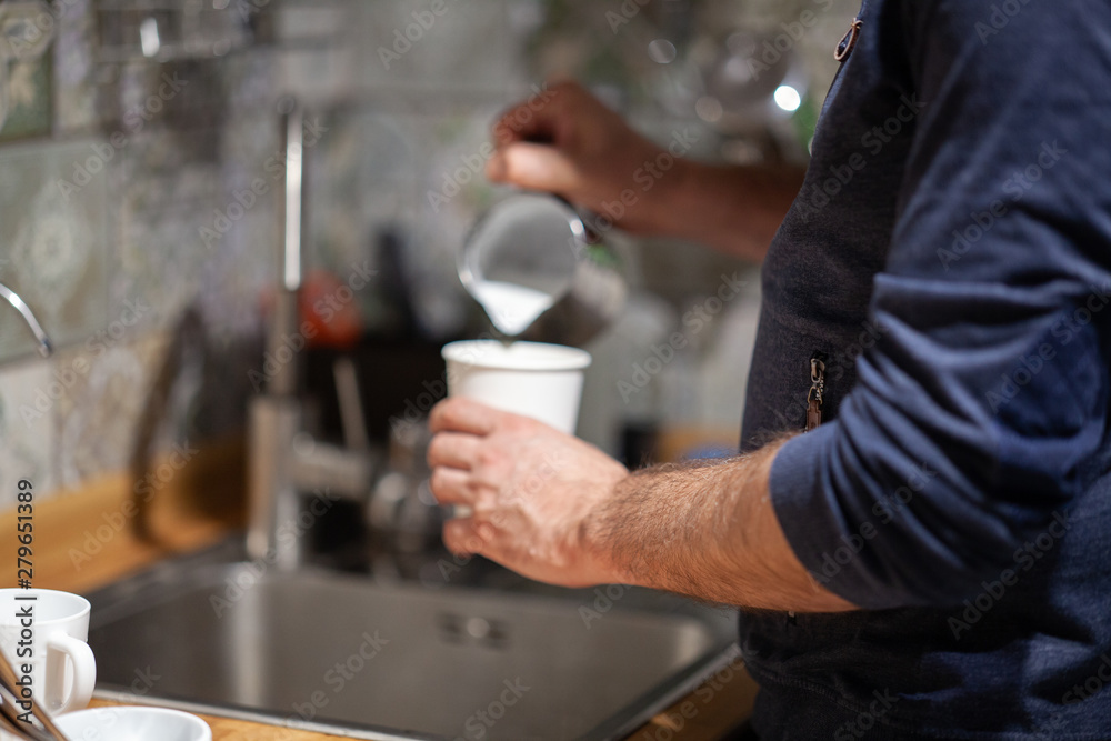 Barista makes coffee in the coffee machine another Barista teaches you to do it