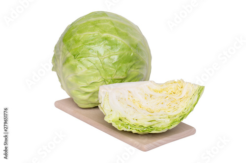 Whole and piece fresh cabbage head on a wooden coaster, isolated, cutout