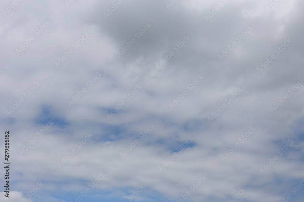 Blue sky with clouds. Background of white and gray clouds.