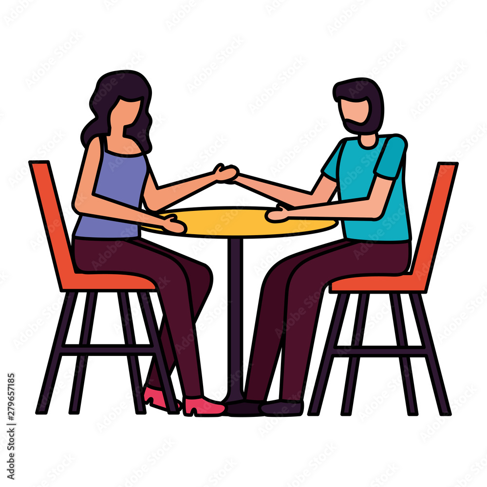 young lovers couple seated in restaurant table young lovers couple seated in restaurant table