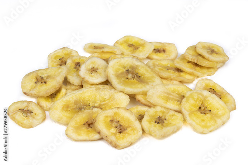 Dried banana pieces isolated on a white background.