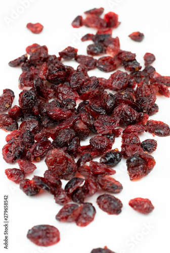 Dried red cranberries isolated on a white background.