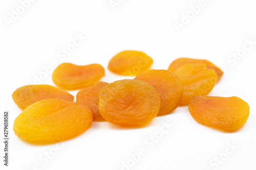 Orange dried apricots isolated on a white background.