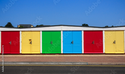 row of colourful Beach huts in Exmouth, UK