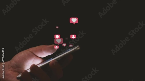 Social Media Concept Close Up of Hand Scrolling Smartphone Screen with Animated Flying Social Media Icons, Like, Comment, Follower photo