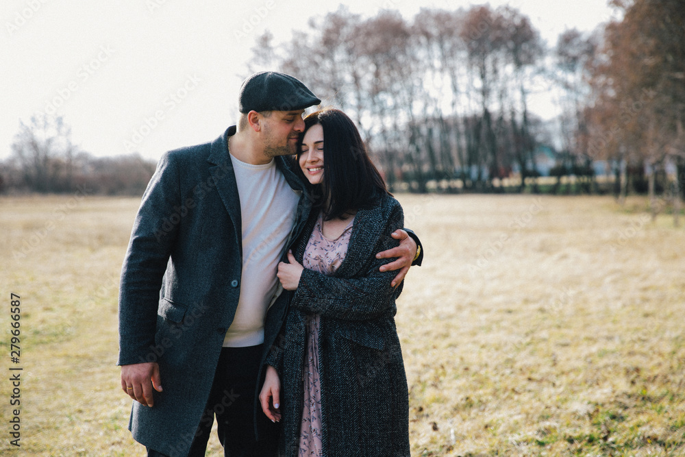 lovely young couple hugging outdoors in autumn lovely young couple hugging outdoors in autumn