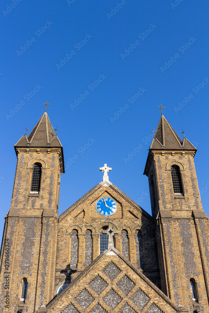 Church towers clock with blue sky background