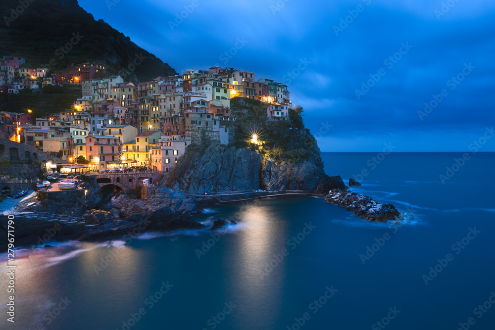 View of town Manarola in late afternoon light.