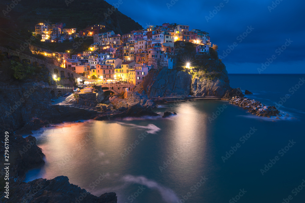 View of town Manarola in late afternoon light.