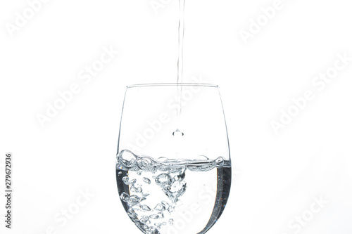 A glass of water on a white background. Close-up