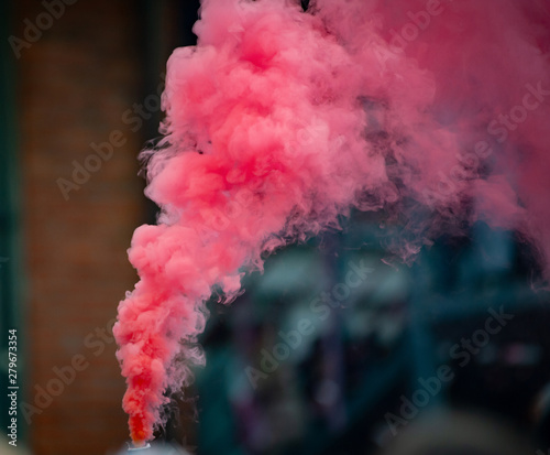 Colorful pink smoke from smoke bomb